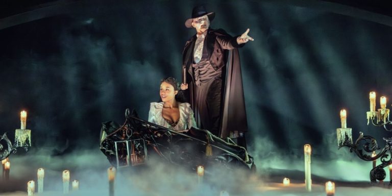 A production shot of Christine and the Phantom from Phantom of the Opera