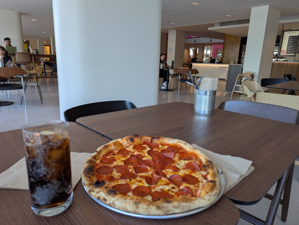 A pepperoni pizza on a table.