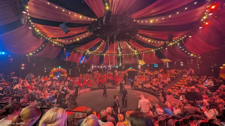 Photo of the Come Alive auditorium from midway back, with circus set dressing visible.